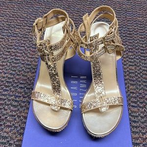 Brand New gold glitter wedge.  Stored in box and closet.Never worn tried on